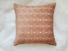 Load image into Gallery viewer, This 20 x 20 pillow cover features rich velvety salmon hexagons wrapped in beige trim to create a geometric gem with two distinct but blended sides. Material is mixed fibers. 
