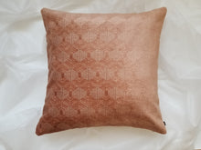 Load image into Gallery viewer, This 20 x 20 pillow cover features rich velvety salmon hexagons wrapped in beige trim to create a geometric gem with two distinct but blended sides. Material is mixed fibers. 
