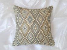 Load image into Gallery viewer, 16 x 16 inch pillow cover made of 100% mixed fibers. Various soft hues of beige, blue, teal, cream and green in diamond formation.
