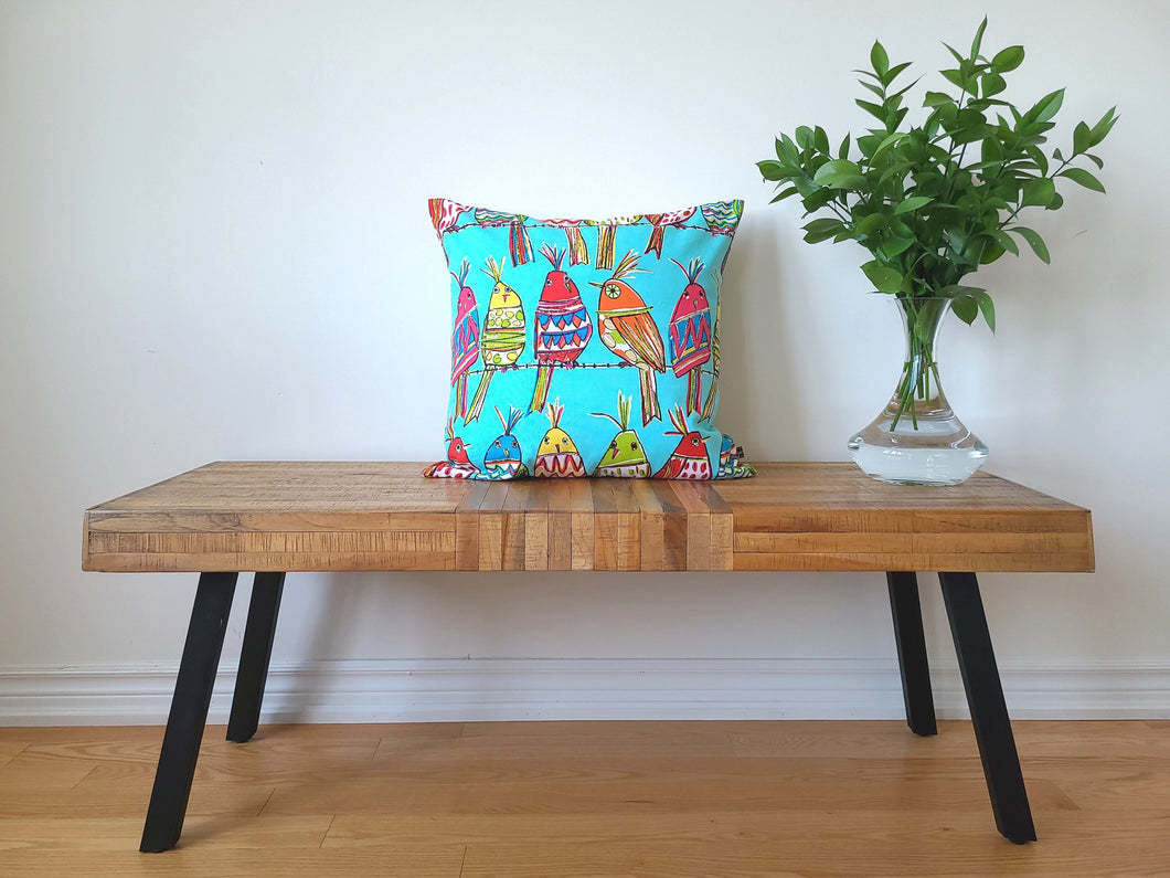 Blue cotton 20 x 20 inch, vibrant pillow cover with multi coloured birds perching on a wire, fun, fresh, and bold.