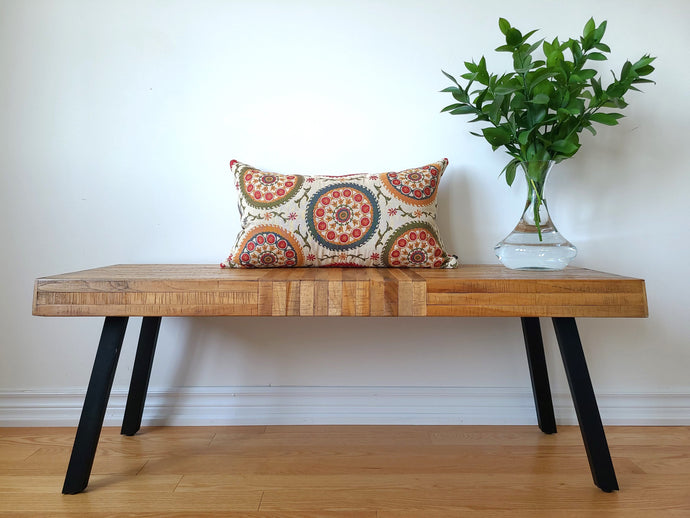 Boho-Retro inspired pillow cover, main colour is cream with beautiful multi-coloured circles (burnt oranges, green, red, tangerine, and turquoise) lined with flowers and stems. 14 x 24 inches made from mixed fibers.