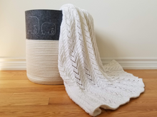 Load image into Gallery viewer, White, hand knit baby blanket, 55 x 40 inches, perfect for any nursery, 100% acrylic.  
