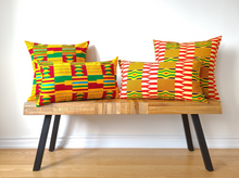 Load image into Gallery viewer, Rich and bold beautiful 20 x 20 inch West African multi coloured Kente pattern pillow. Boast vibrant colours in various geometric shapes and stripes including red, yellow, green, black, white, and gold. This gorgeous pillow is made from 100% cotton.
