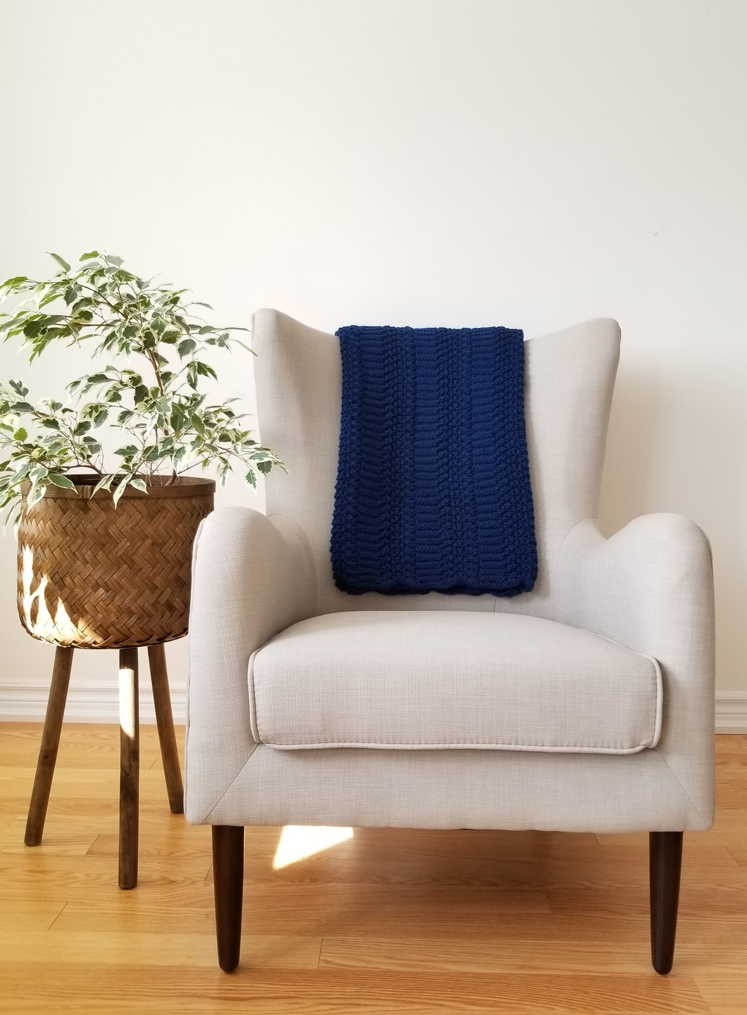 Rich navy blue throw blanket, 45 x 65 inches with intricate detail  